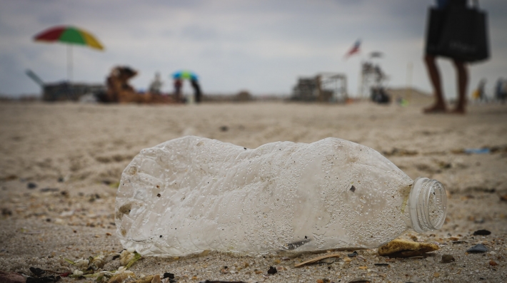 Clear plastic bottle on a beach