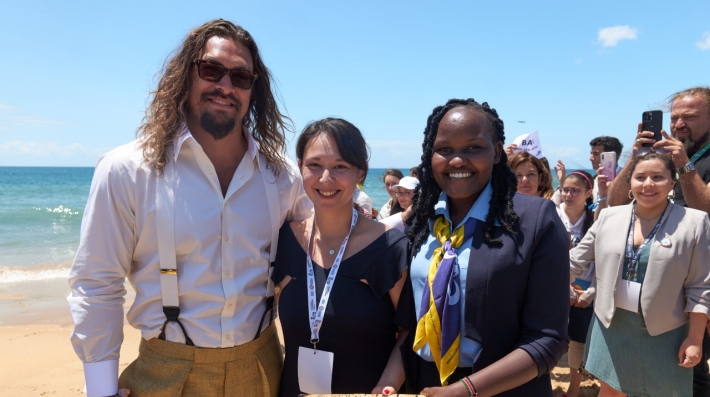 Hollywood star Jason Momoa stands on a beach