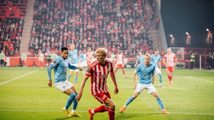e soccer players on a pitch