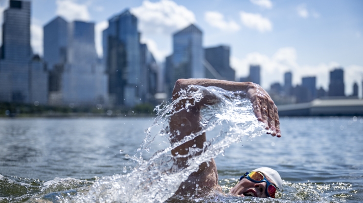 A man swimming in a river