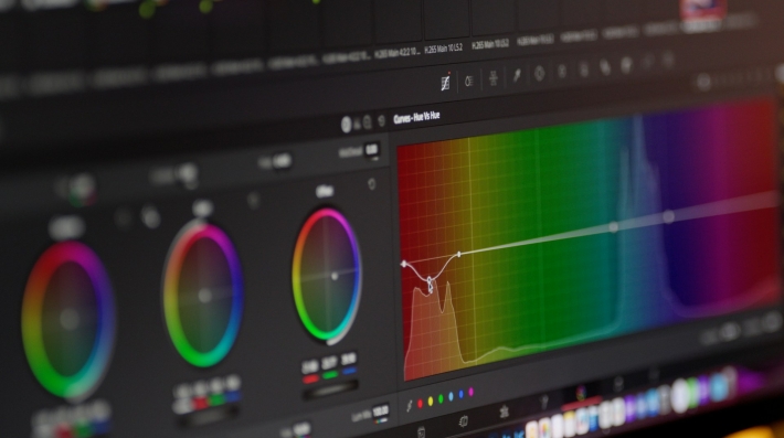 Color grading software is displayed on the screen