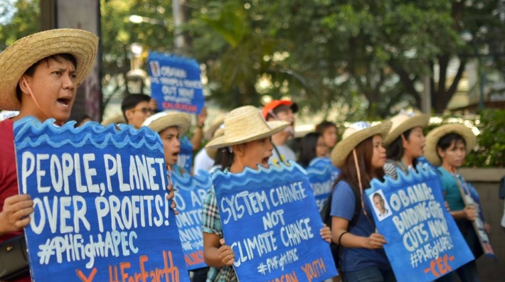 Climate activists protesting against the environmental practices of some foreign companies.