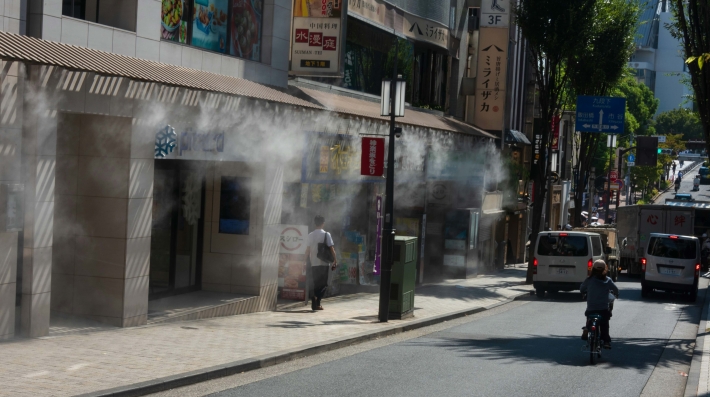 Photo on street with water jets to cool down